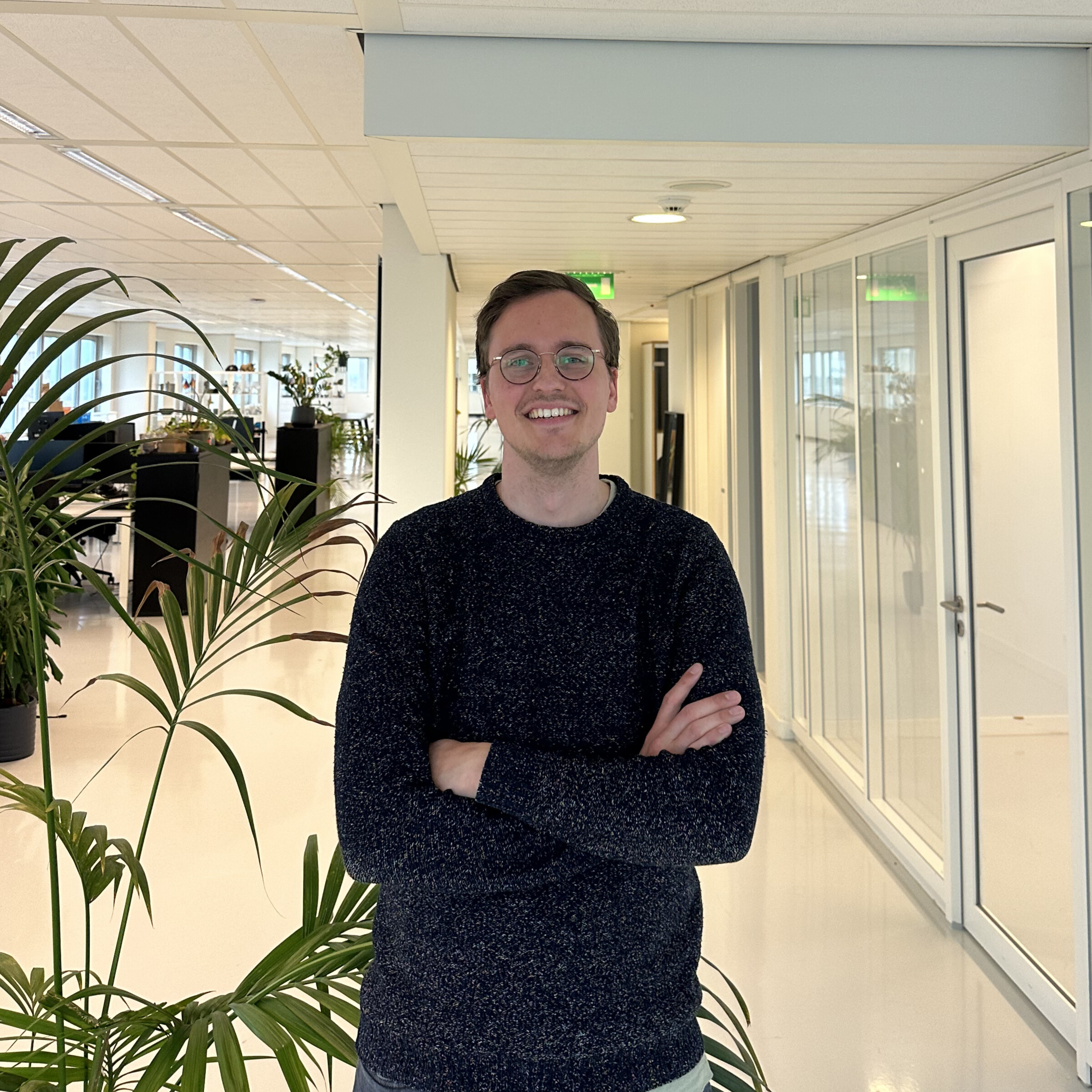 Me proudly standing in the 40+ people Dapper office in 2025